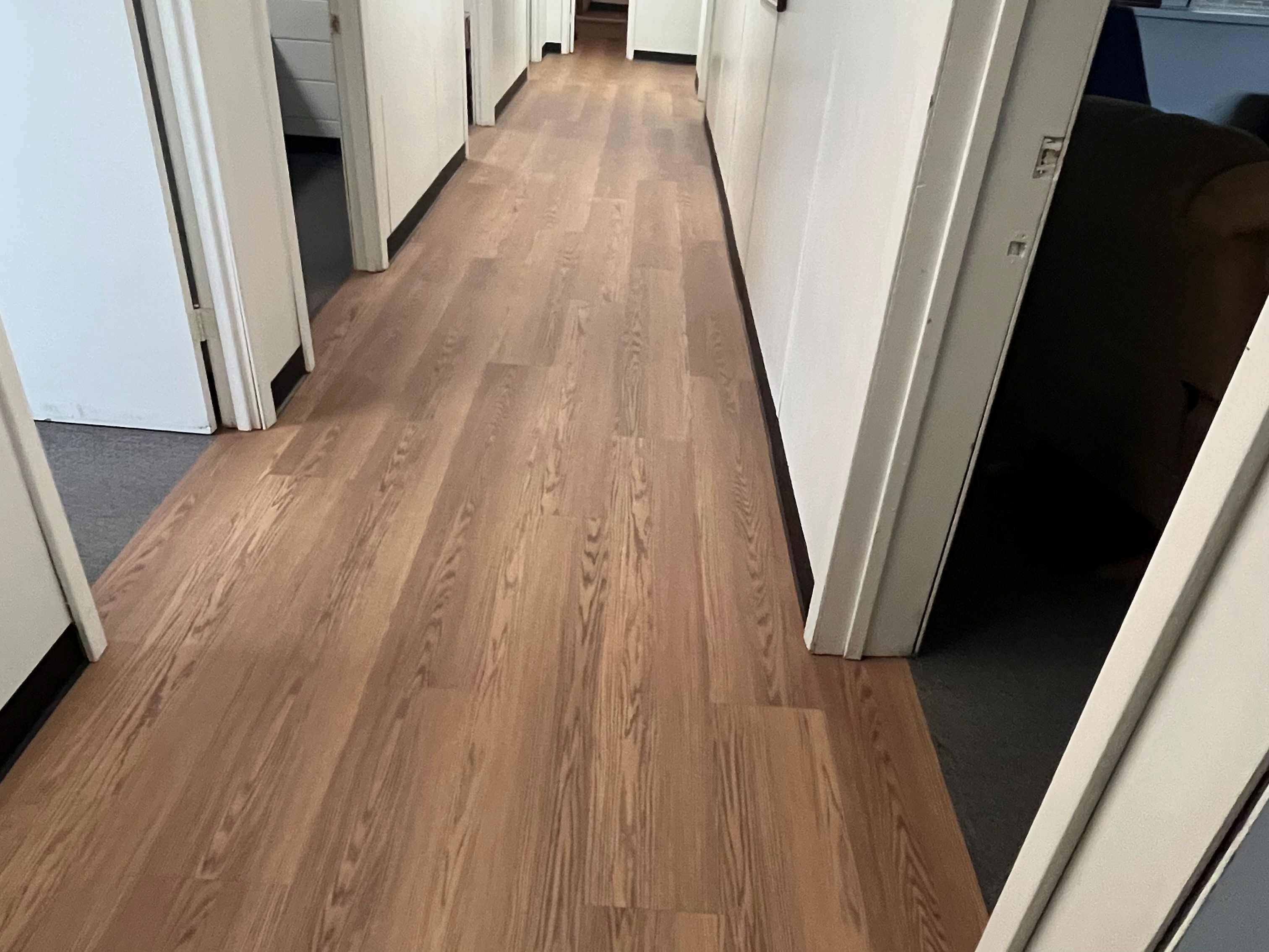 Installed wood-look loose-lay plank flooring